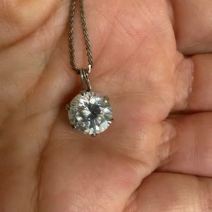 Necklace and a diamond solitaire pendant